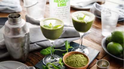 Matcha Cocktail next to a bottle of Absolut Lime and a Boston Shaker.
